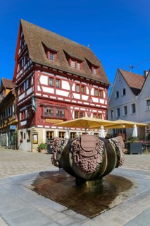 Fountain with inscription Gemmingen, stone grapes, water features, Ratsstueble restaurant at the