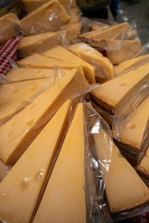 Dutch cheese on display in the town of Alkmaar on a market day., Alkmaar, The Netherlands, Europe