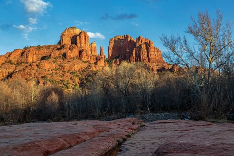 Cathedral Rock sandstone formations tower over Oak Creek at the Crescent Moon Picnic Site in