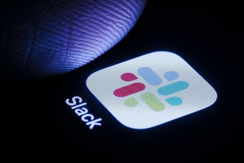 The Slack app icon can be seen on a smartphone. Berlin, 30.05.2024