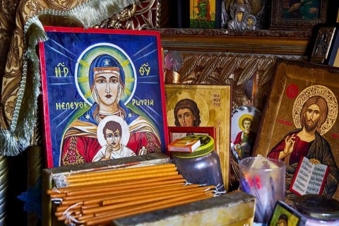 Rock chapel, Archangel Michael Panormitits, icons and religious objects on a devotional altar,