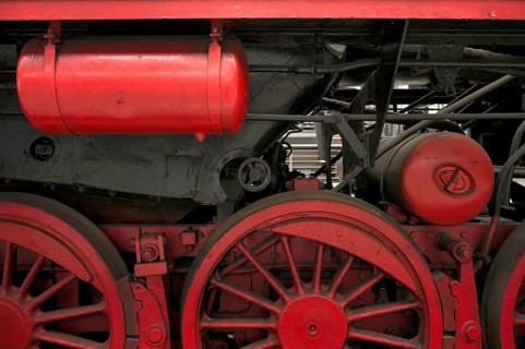 Close-up of engine, wheels, steam locomotive class 52 of the Deutsche Reichsbahn DR with tub