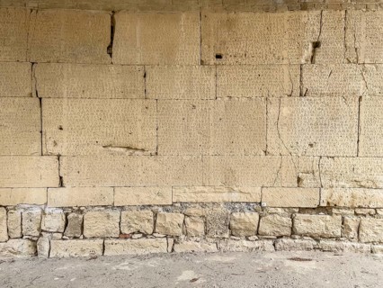 View of sandstone blocks Stones made of sandstone with written chiselled laws carved into the wall