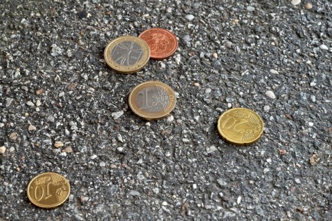 Money lying on the street, two one euro pieces, 20 cent, 10 cent, 5 cent