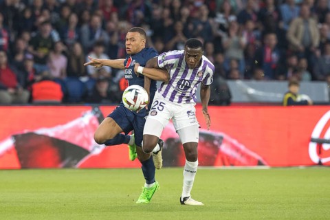 Football match, captain Kylian MBAPPE' Paris St. Germain left in a duel for the ball with Kevin