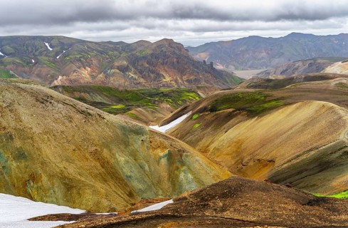 Colourful volcanic landscape with hills and snow, Laugavegur trekking trail, Landmannalaugar,
