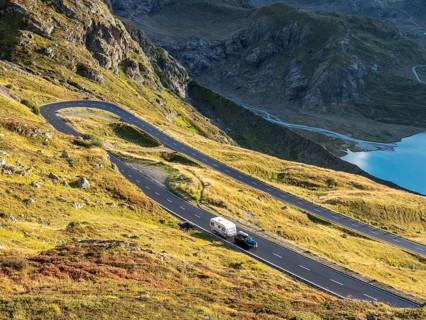 Car with caravan, Sustenpass, swiss mountain pass, Switzerland, Europe