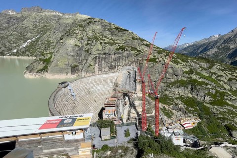 View of construction site of new dam for enlargement of reservoir Grimselsee replacement dam