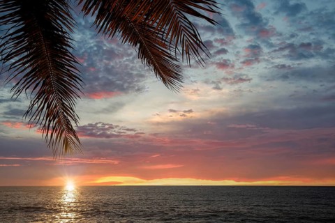 Famous Puerto Vallarta sunsets on sea promenade, El Malecon, with ocean lookouts, beaches, scenic