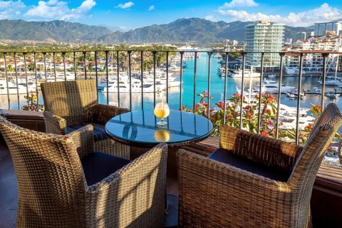 Mexico, Puerto Vallarta El Faro lighthouse with panoramic view of marina from restaurant on top,
