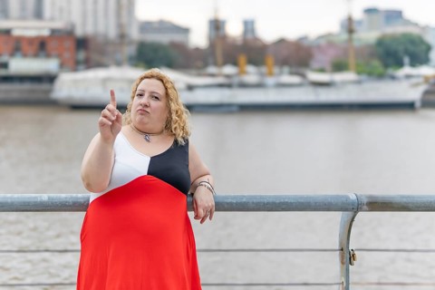 Plus size woman saying no with her hand. Stop concept. Rejection concept. Non-approval concept