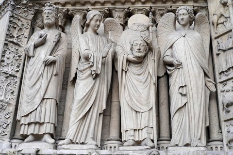 Figures of saints, Detail of the Gothic entrance portal of Notre Dame de Paris Cathedral, Paris,