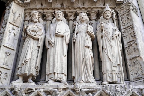 Figures of saints, Detail of the Gothic entrance portal of Notre Dame de Paris Cathedral, Paris,