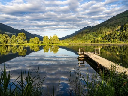Footbridge leading into a lake, Gaishorner See in the evening light, Gaishorn am See, Paltental,
