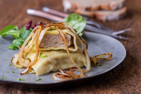 Swabian maultasche with onions on a plate
