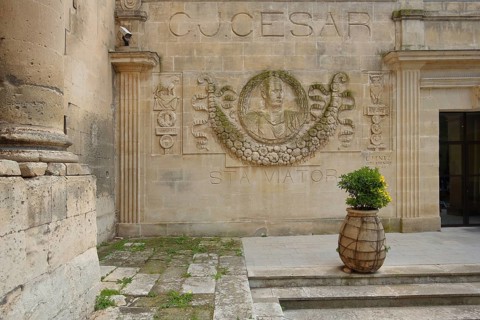 Relief and monument to Roman Emperor Julius Caesar with inscription, Hotel Jules César, Arles,
