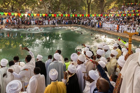 Ethiopian crowd at Timkat festival at Fasilides Bath in Gondar, Ethiopia, Africa