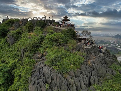 Top pagoda of Hang Mua temple with dragon in Tam Coc, Ninh Binh province