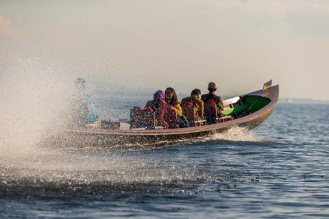 Water spitting canoe whizzing on water
