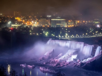 Niagara Falls lit at night seen from the Canadian side
