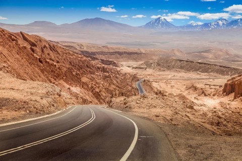 Road leading through the arid landscape at the Valley of the Moon in Chile