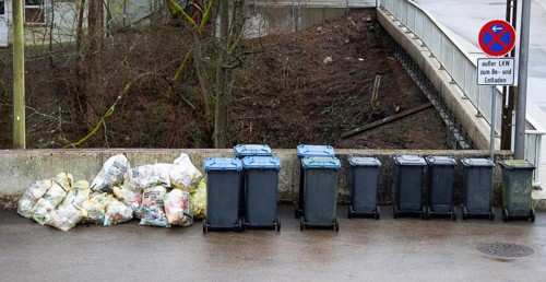 Pile of waste plastic trash bags and bins in Germany, garbage collection, environment and pollution
