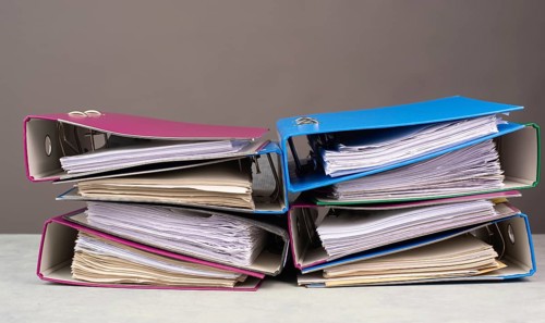 Pile of file folders, burnout, stress and overworked, pressure at work, deadline