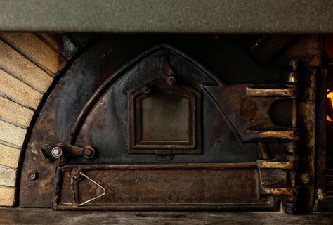 Antique wood oven with cast iron door