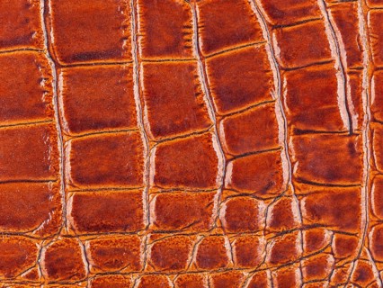 Abstract texture of synthetic leather, brown background
