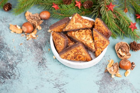Nut corner triangles, traditional german sweets called Nussecke, covered with chocolate, christmas