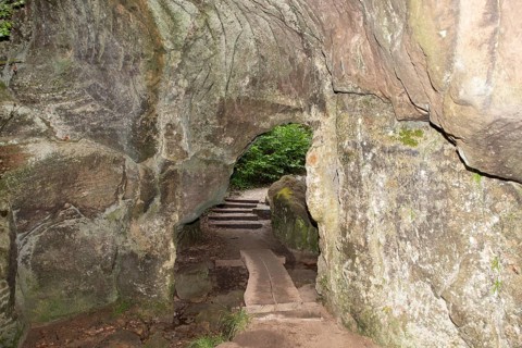 Huel Lee or Hohllay on the Mullerthal trail in Luxembourg, open cave with view to the forest,