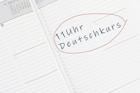 The words german course at 11 oÂ´clock are standing in the german language in the calendar,