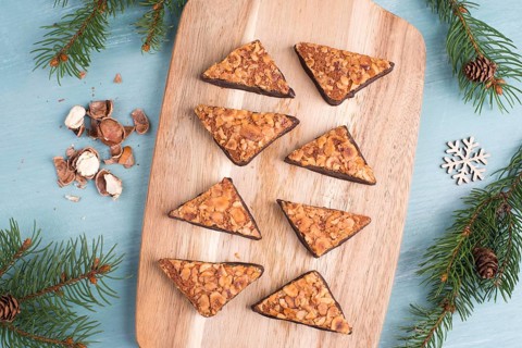 Nut corner, traditional german sweets called Nussecke, covered with chocolate, christmas baking