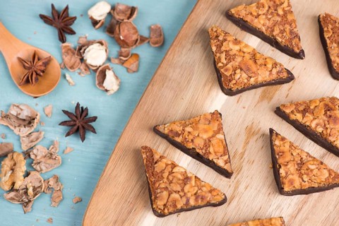 Nut corner, traditional german sweets called Nussecke, covered with chocolate, christmas baking