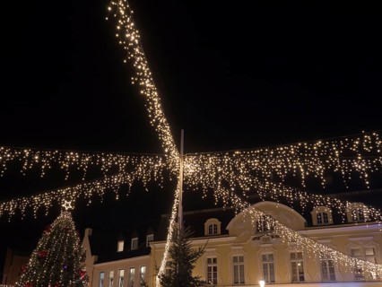 Fairy lights stretching across a square and festively illuminating a building, Ahaus, Münsterland,