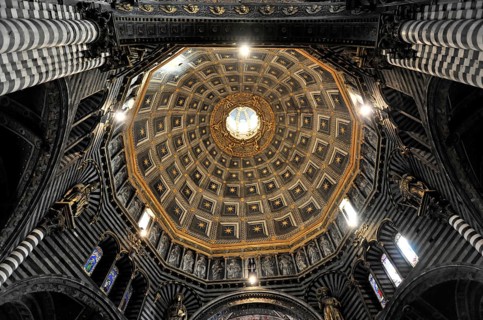The dome of the cathedral with starry sky and black and white striped marble columns and round