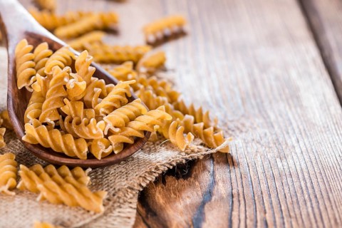 Wooden Spoon with a portion of wholemeal Fussili