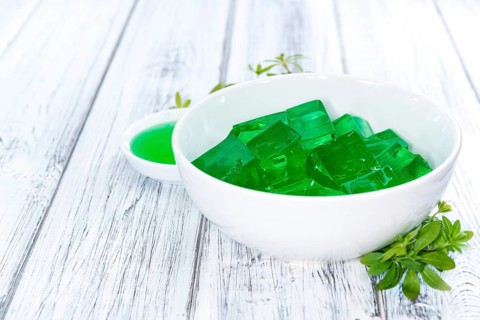 Fresh made Woodruff Jello (close-up shot) on wooden background