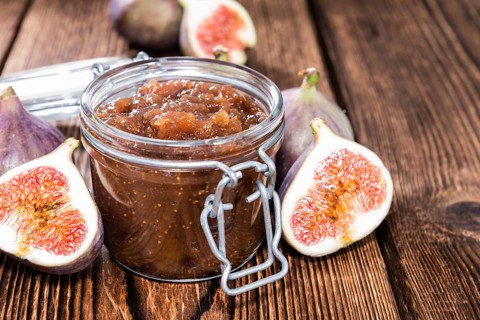 Fig Marmalade in a glass (detailed close-up shot)
