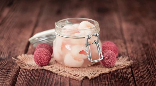 Preserved Lychees on a vintage background as detailed close-up shot (selective focus)