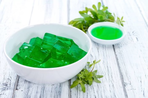 Fresh made Woodruff Jello (close-up shot) on wooden background