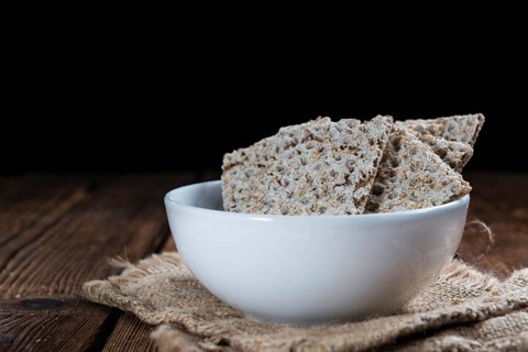 Crispbread (selective focus) on an vintage wooden table