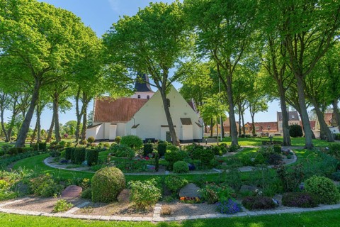 Bogense on the Kattegat, St Nicolas Church, Danish architecture, group of trees, graves,
