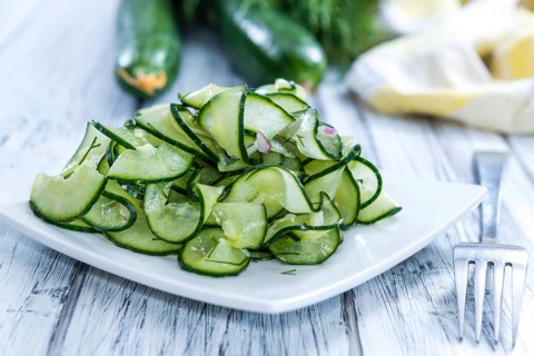 Fresh made Cucumber Salad in a bowl (close-up shot)