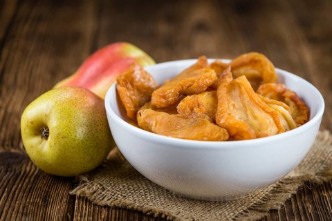 Some dried Pears (selective focus, close-up shot) on wooden background