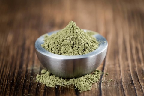Stevia leaf powder (detailed close-up shot) on rustic wooden background