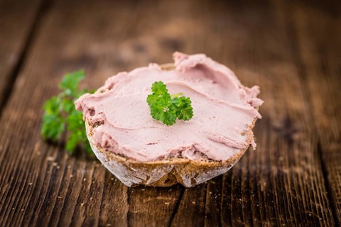 Liverwurst Sandwich on a vintage background as detailed close-up shot (selective focus)
