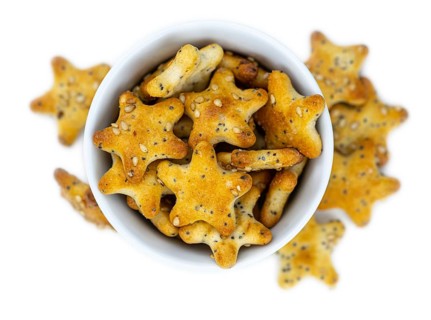 Portion of mixed Snacks isolated on white background (detailed close up shot, selective focus)