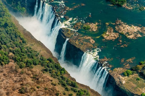 Victoria Falls at drought near Livingstone, Zimbabwe, as aerial shot made from a helicopter, Africa