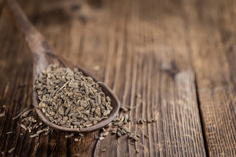 Dried Valerian roots (detailed close-up shot) on wooden background